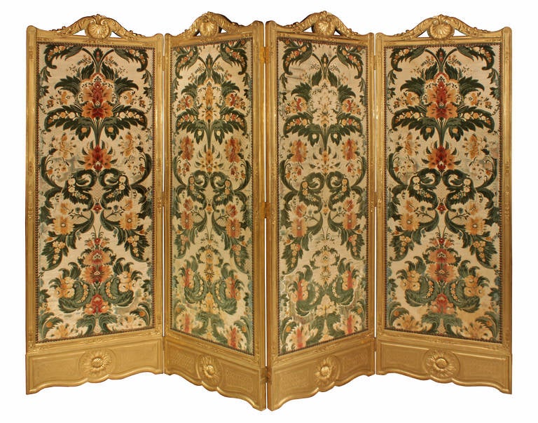 A stunning French late 19th century Louis XV style four-panel giltwood screen attributed to Linke. Each panel measures 28