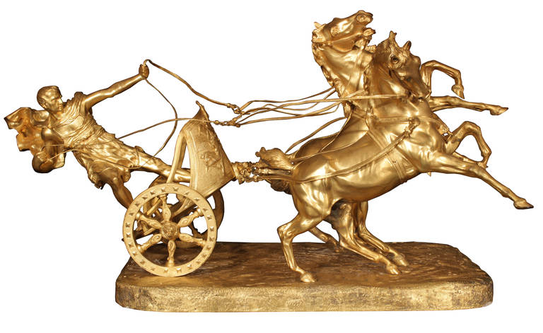 A spectacular and extremely finely chased Italian 19th Century ormolu sculpture signed Vanetti. The statue is raised on a rectangular ormolu base. Above is a Roman gladiator in classic dress leaning back on a chariot, with his cape billowing in the