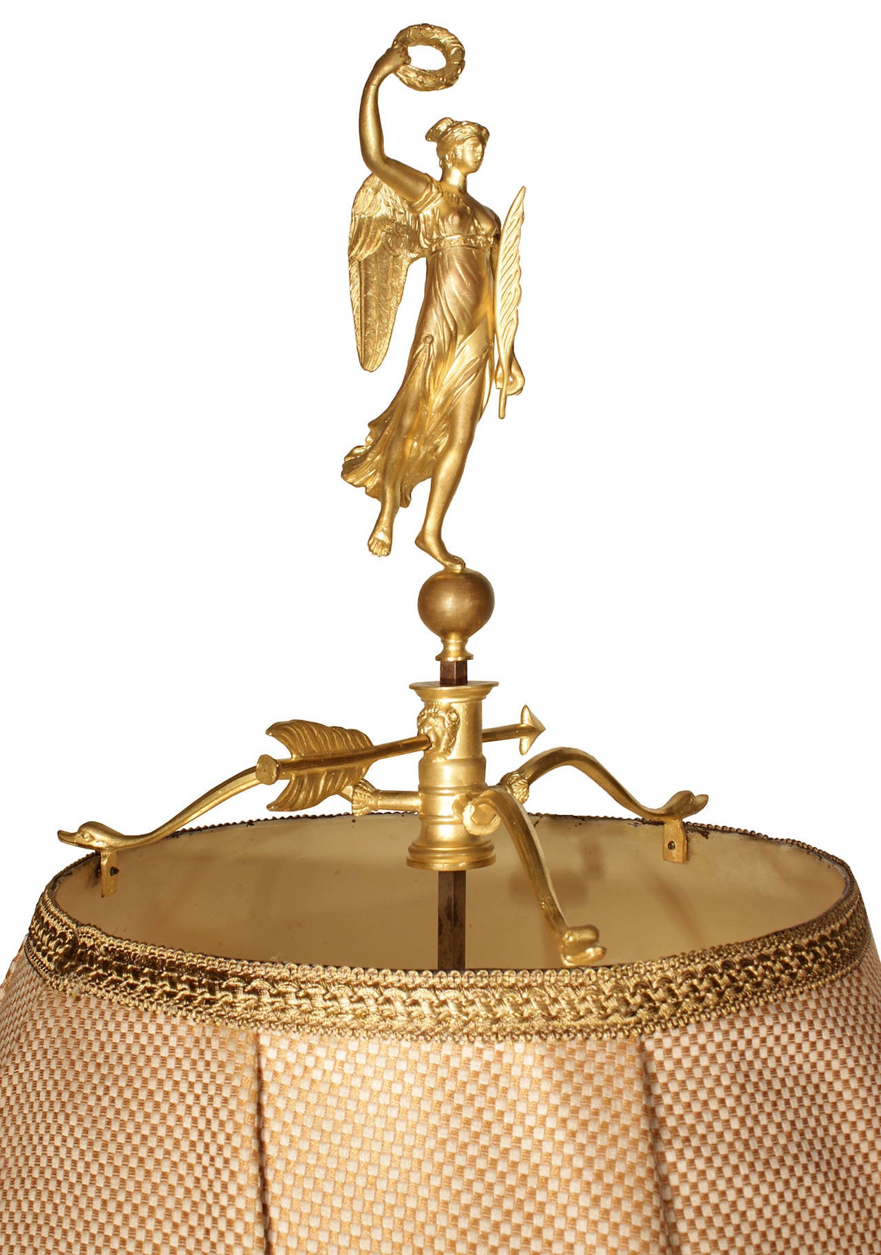 A charming and high quality French 19th century Empire st. ormolu Bouillotte Lamp. The lamp is raised by a circular ormolu base with acanthus leaves, Rai-de-Coeur and reeded patterns. At the fut are fine mounts of winged maidens. Each of the three C