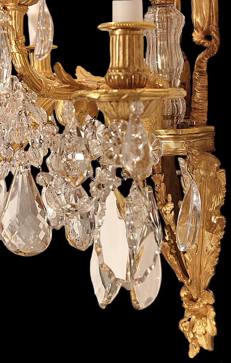 A pair of French mid 19th century Louis XVI st. ormolu and crystal sconces 1