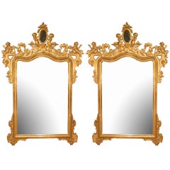 A pair of Italian 19th century richly carved giltwood mirrors 10