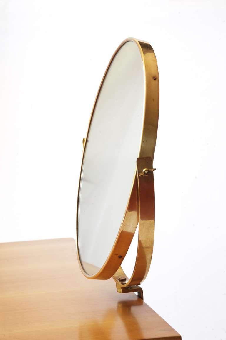 GIO PONTI vanity  produced by Giordano Chiesa for the furniture of the Hotel Royal in Naples , 1955 
mirror by Fontana Arte 
cherrywood, brass and mirror glass
perfect original condition 
Misure: h 78cm 94 x 44 cm (vanity) mirror: dia 40 cm:
