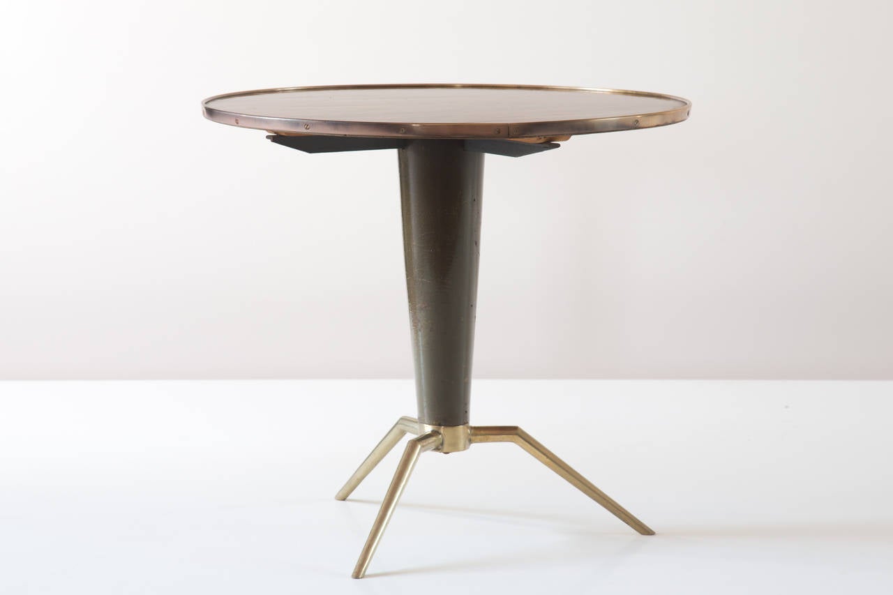 organic coffee table attributed to Melchiorre Bega 1950 
three feet 
rosewwod, brass and walnut 
Measures: H 46cm diam 50 cm 
good original condition