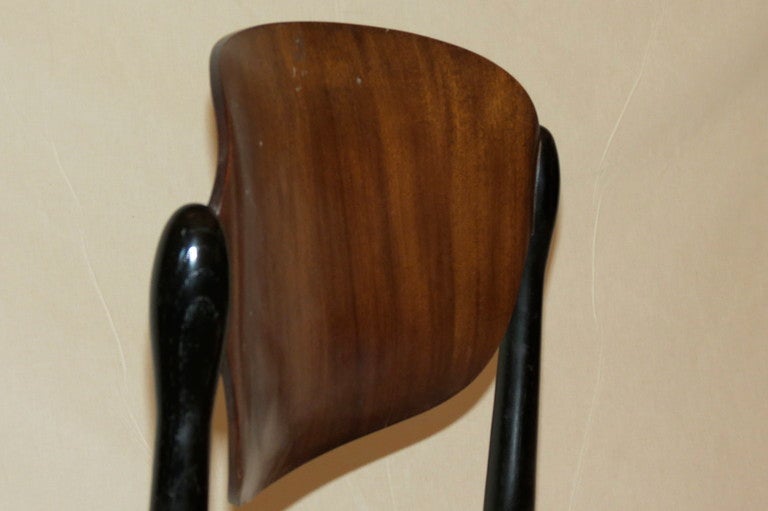 a pari of S83 chair produced by Tecno in 1962 and designed by Egugenio Gerli;stackable chair with seat and backrest in curved pluwood 
Misure: h: 78,5 53x 48 cm 
Bibliography:Giuliana Gramigna 