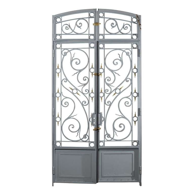 Gorgeous 19th century wrought iron entryway with bronze detailing, operable glazed panels and transom, circa 1860.  

Entryway is primed and ready for paint.