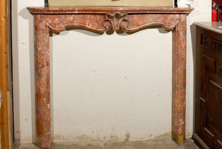 Rare 18th century Venetian Rococo hand carved marble mantel, circa 1740.  Classic serpentine apron with carved shell motif in the center.  

Interior opening measures:  48