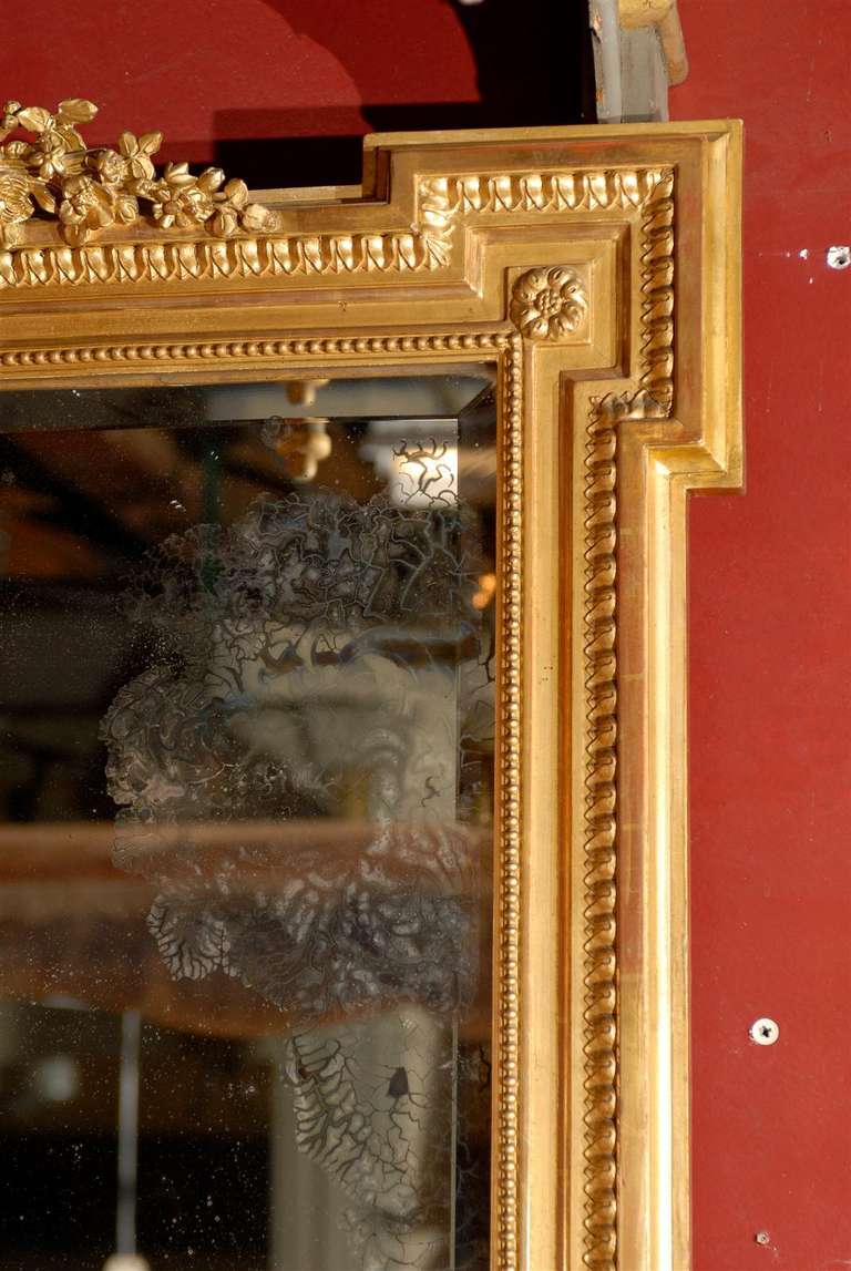 Carved 19th Century French Gilded Trumeau with Original Mirror Glass For Sale