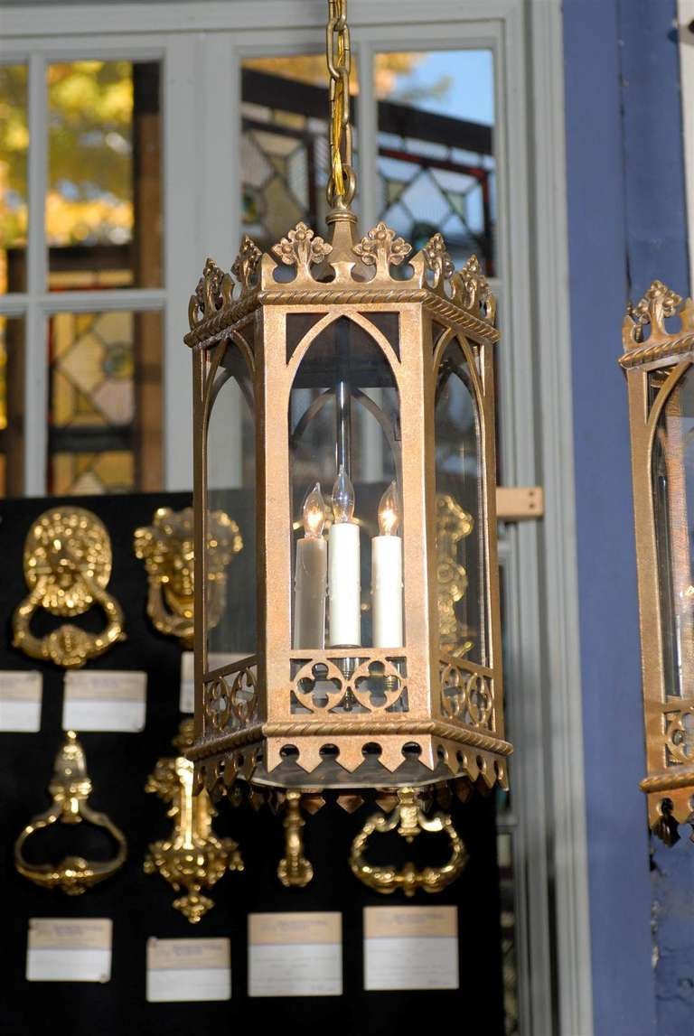 Lovely 19th century cast bronze Gothic style lantern from New York City.  Each hexagonal lantern includes a triple candelabra and a clear glass base.<br />
<br />
UL LISTED.  Lantern sold individually; multiples available.  <br />
<br />

