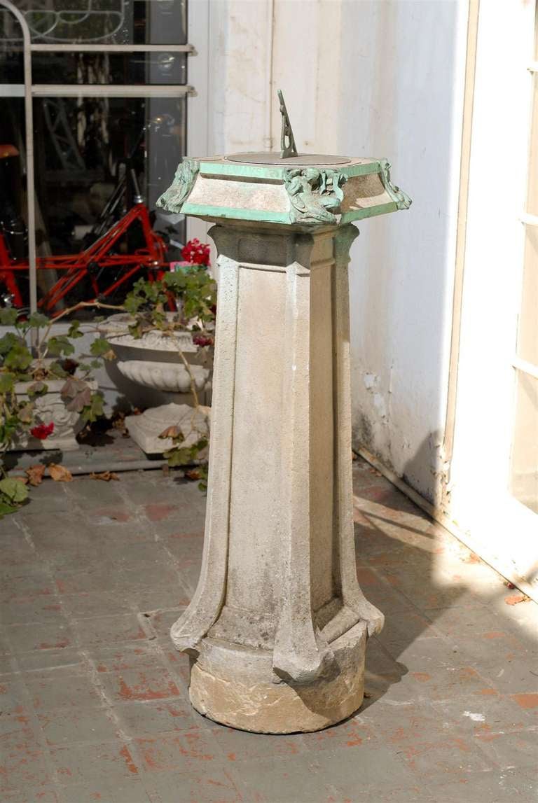 Early 20th century Art Nouveau stone & bronze pedestal sundial, circa 1900.  This sundial was reportedly removed from Pablo Picasso's garden in the south of France; this fact has not been substantiated The sundial features for figures on each corner