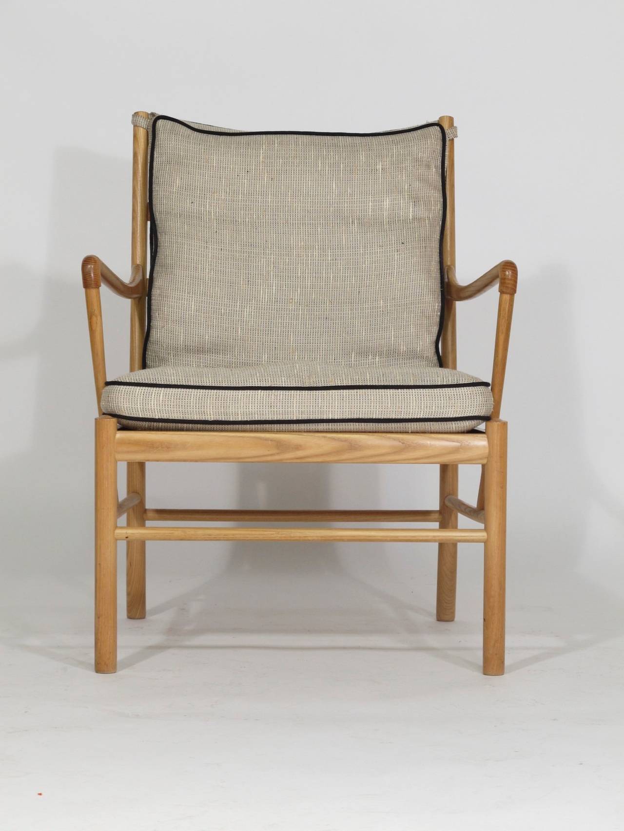 Colonial chair designed by Ole Wanscher for P. Jeppesen, model PJ 149. Solid ash frame with cane seat and original down-filled cushions.