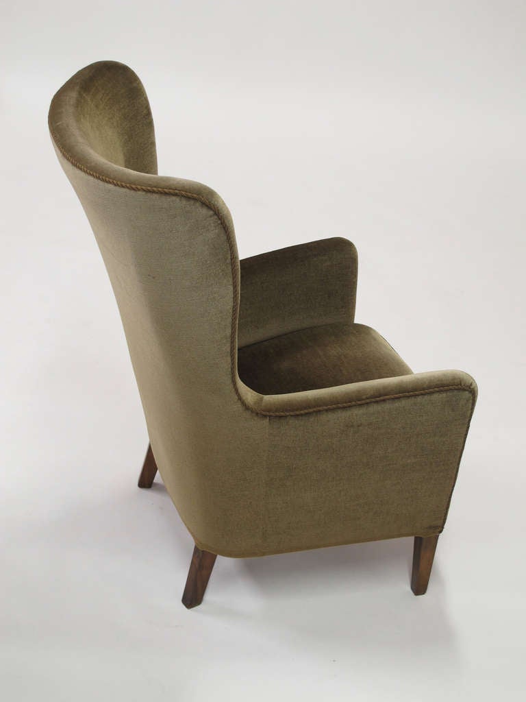 1930's High-back chair features a solid wood frame with hand tied springs, horsehair padding and original mohair wool fabric.