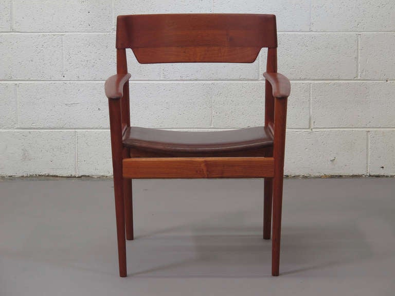 Pair of solid teak arm chairs designed by Greta Jalk for P. Jeppesen, model PJ 4-2, seats newly upholstered in finely distressed brown leather.