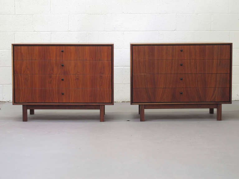 Pair of Milo Baughman for Arch Gordon four drawer dressers in walnut with black recessed border and pulls.
