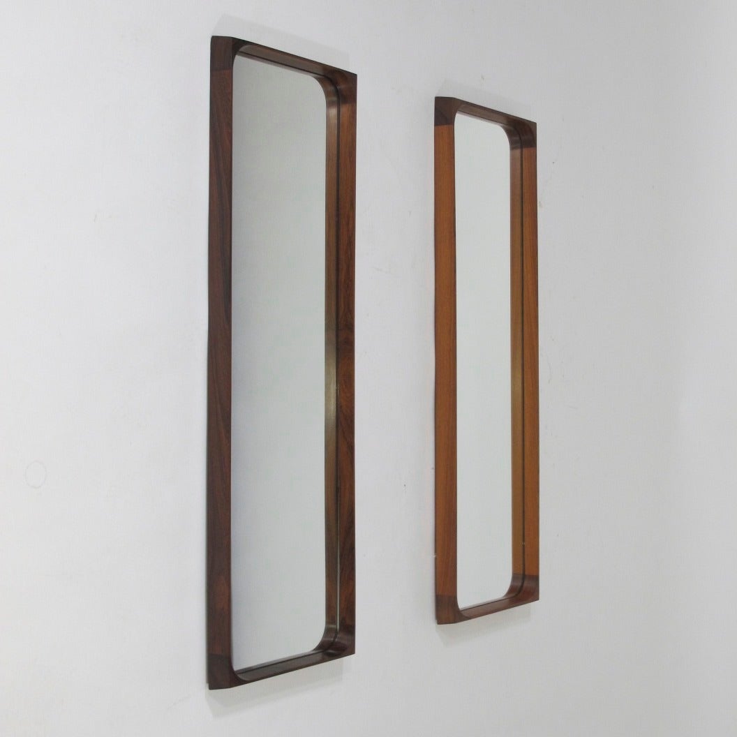 Finely crafted Danish Brazilian rosewood frame mirrors with rich grain and beveled edge. Two available. Can be sold separately.