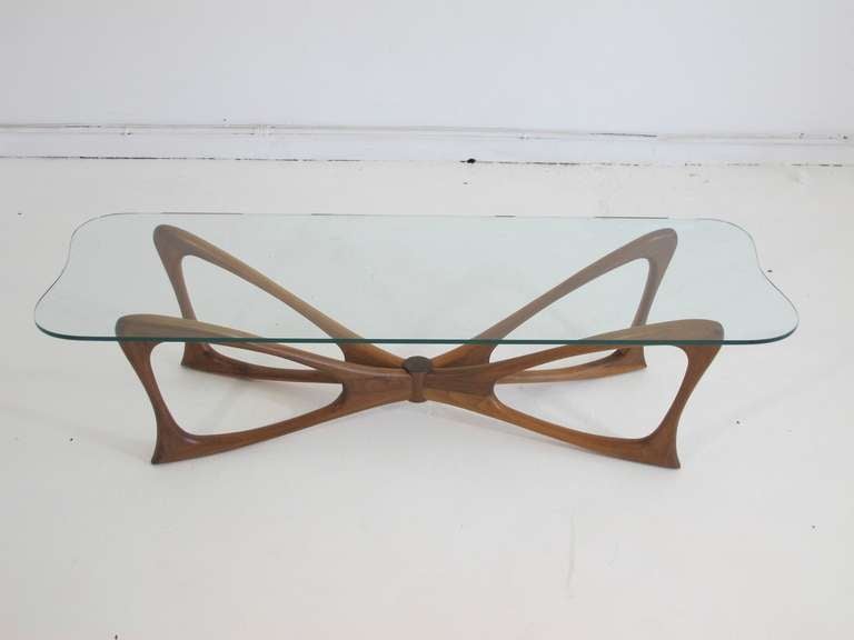 Sculptural form walnut and glass top coffee table in form of a Dragonfly. Finely crafted and eye-catching.