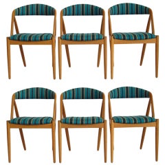 Retro Kai Kristiansen curved back dining chairs with teal upholstery
