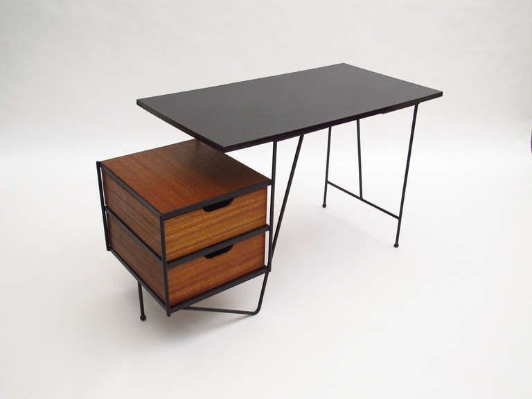 Modern Iron frame desk with floating original black formica top and mahogany drawers from Vista of California designed by D.R. Bates & Jackson Gregory Jr. Vista of California. The desk can be positioned with the drawers on either the right or left