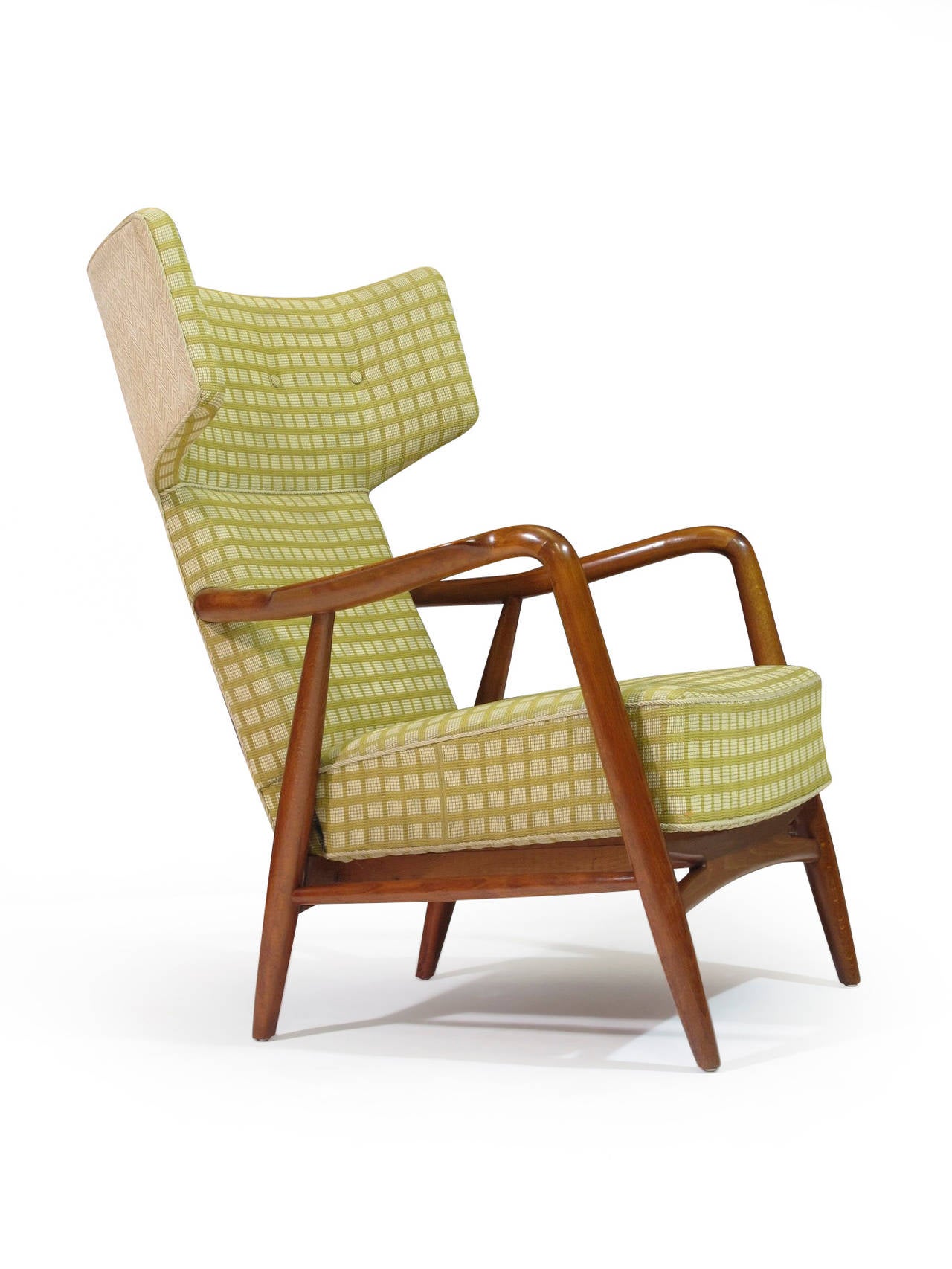 Button tufted Mid-Century highback lounge chair with a sculpted cherry-stained beech frame with open arms, upholstered in the original yellow/green checkered woven textile. Designed in 1947 by architects Nils and Eva Koppel, manufactured by Slagelse