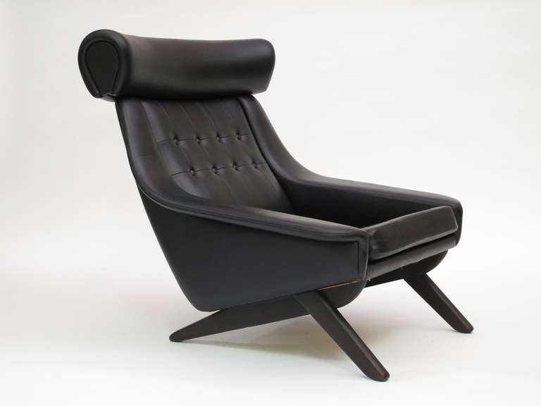 Illum Wikkelso high-back lounge chair upholstered in original black vinyl.
