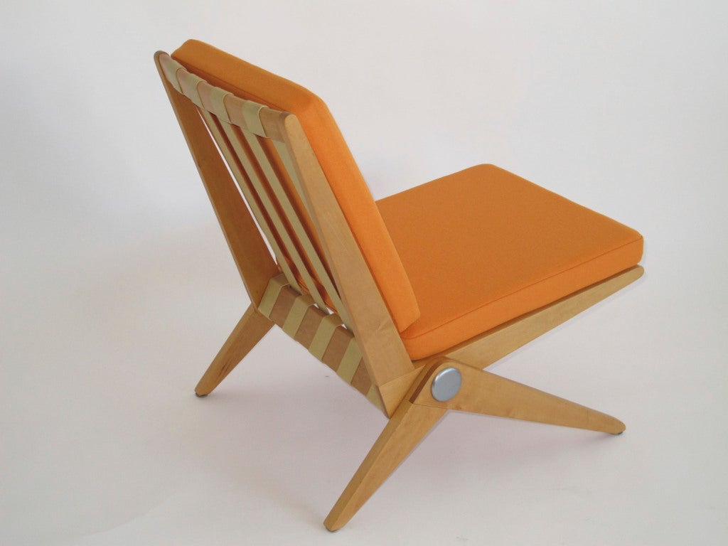 Pierre Jeanneret Scissor chair by Knoll, c.1950, model #92. Birch wood frame and elastic webbing with steel bolt. cushions reupholstered in orange wool textile.