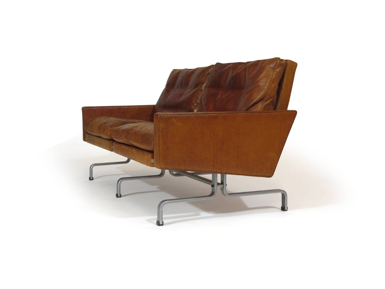 PK-31/2 flat steel and leather sofa by Poul Kjærholm for E. Kold Christensen, circa 1958. In the original red leather which has lightened and developed a heavy patina over time.
