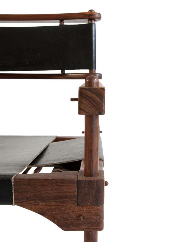 Experimental chair design by Don Shoemaker known as the Perno chair, a sophisticated Safari chair. This rare, limited production chair was hand-crafted of solid brazilian rosewood by Don Shoemaker. The complex design can be assembled, or