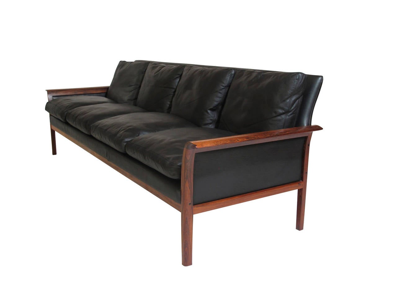Mid-century Brazilian Rosewood three seat sofa designed by Hans Olsen. Solid Brazilian Rosewood frame with unique flared arms. Original black leather with goose down filled cushions.