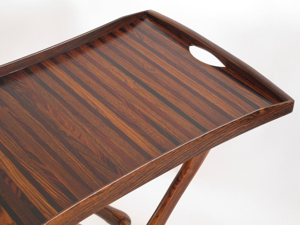 Pair of Don Shoemaker folding TV tray tables. Handcrafted using solid cocobolo rosewood on the folding frame and a series of exotic woods on tray top. Tray can be displayed on the wall when not in use. Hand signed.