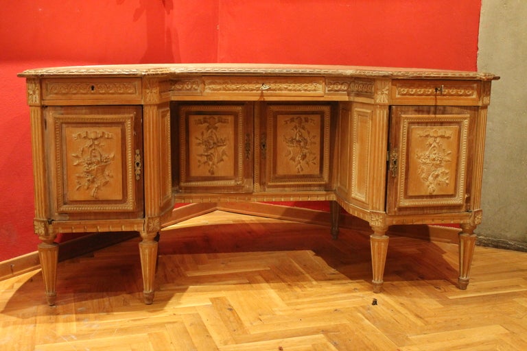 France 19th century
A very rare oak centre desk with a tooled leather top and with beautiful detailed carving around all sides, carved oak drawers and doors. Embossed and studded oak armchair in original leather. 
Minor losses on desk’s leather