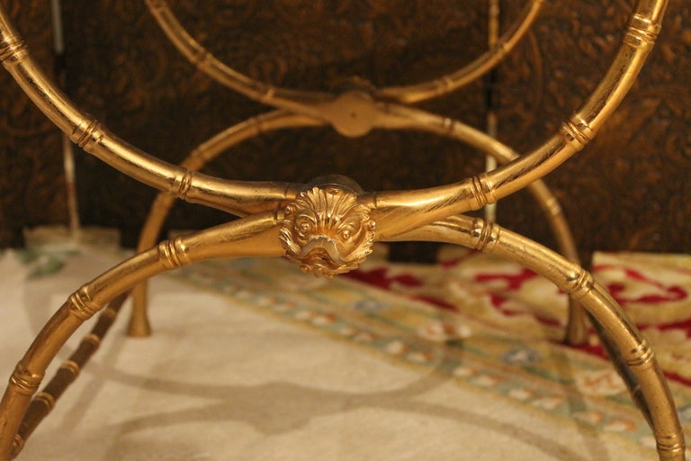 A pair of faux bamboo stools