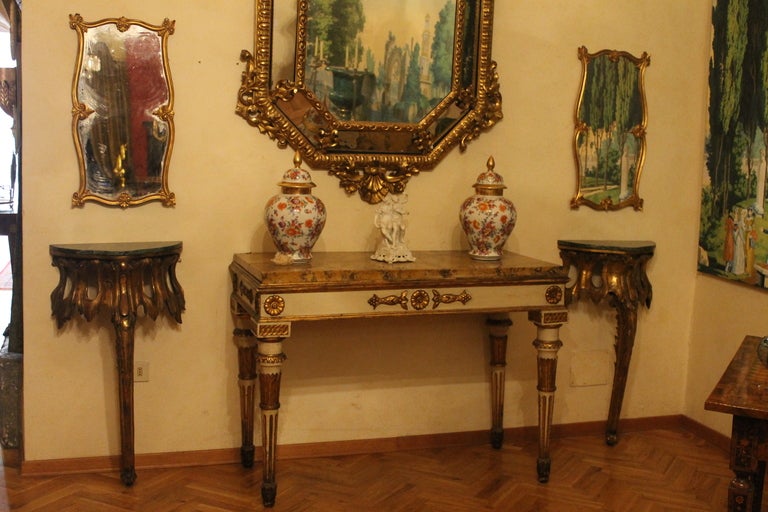 Venice, 1800 circa.
Very elegant giltwood console with green “verde delle Alpi” marble top. The console’s top is gilded so you can use them with or without the marble. Very good patina, Minor losses. We can sold them separately.
Measures: Height