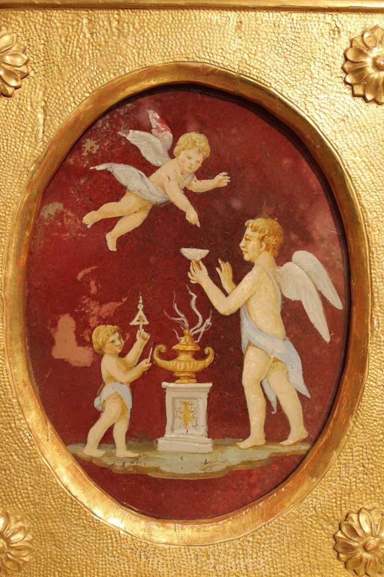 Art Glass Italian Neoclassical Style Putti Oil Painting on Oval Glass in Giltwood Frame
