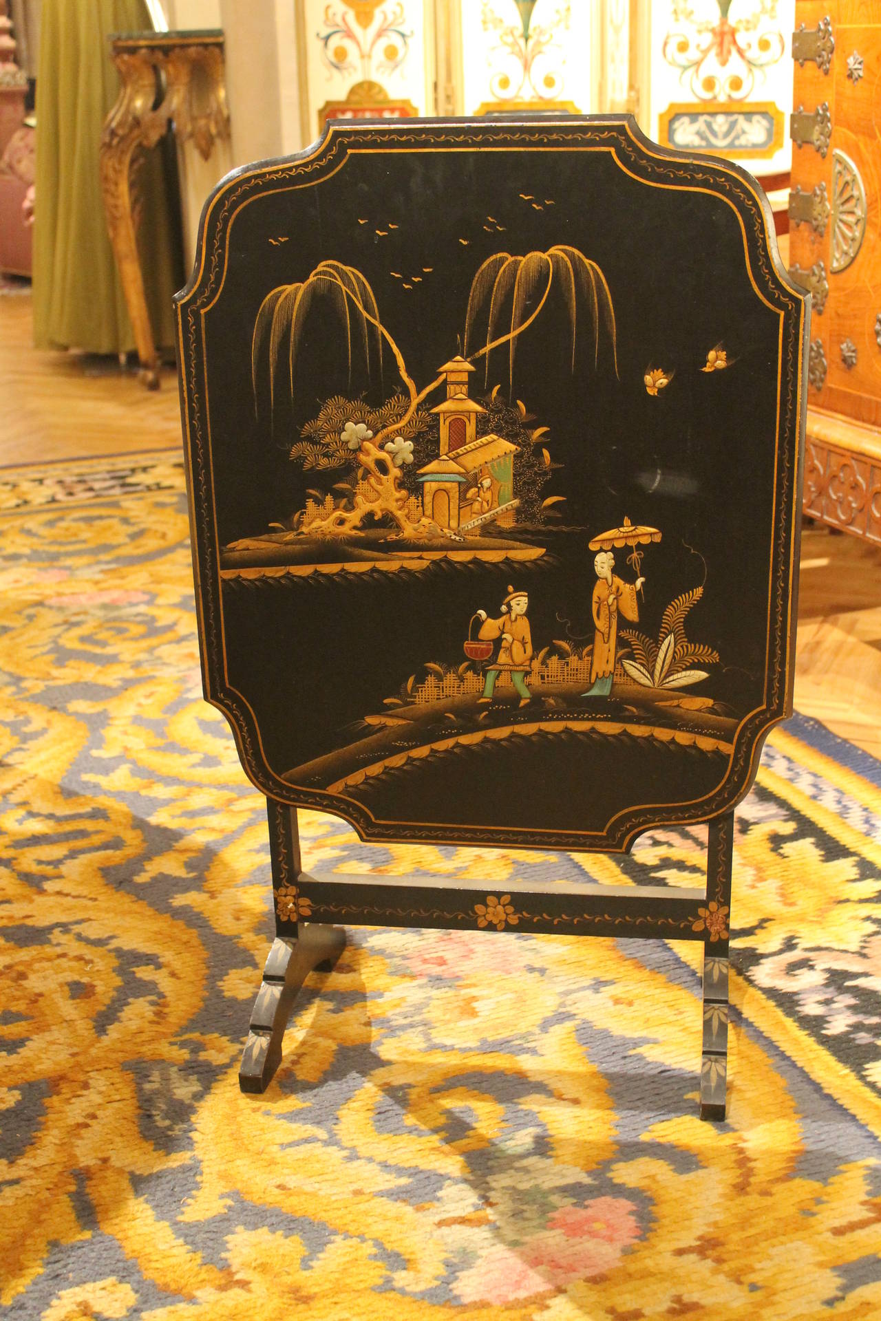 A very fine black lacquered chinoiserie folding table. Beautiful shape and chinoiserie patterns. Very convenient size. Great use for a small dining table, coffee table, game table or side table. Height 51cm, Width 62cm, Depth 51 cm or 3 cm