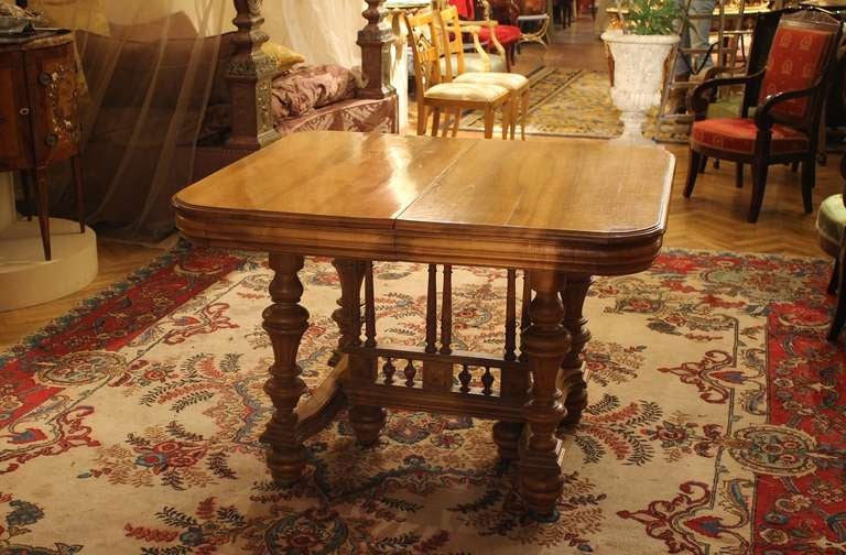 Italy, late 19th century
A very interesting dining table enriched with a fine carved architectural details. Made of prestigious solid blonde walnut wood . It turns into a spectacularly long rectangular dining table with its 3 extensions. The