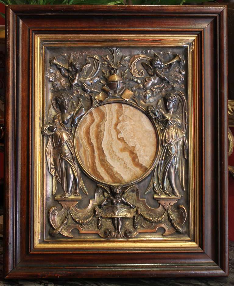 United Kingdom, late 19th century
Elkington silver plate and onyx plaque with wooden frame by the famed Elkington & Co
Elkington & Co. patented the first commercial electroplating process and held Royal Warrants for Queen Victoria, King Edward VI,