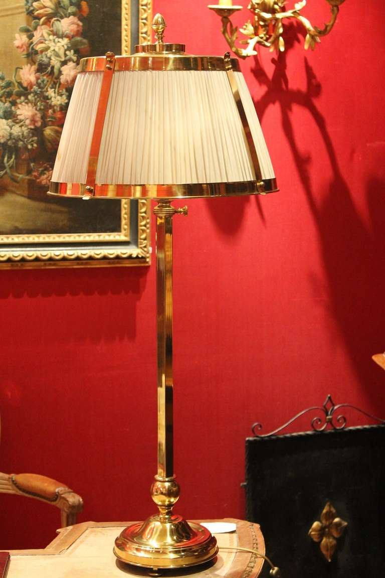 Italy, circa 1930s.
A handsome three-light brass adjustable height table lamp, ivory silk brass trimmed shade. Excellent condition and a real eyecatcher in any interior!
Newly wired for European standards, please ask for US rewiring.
Height