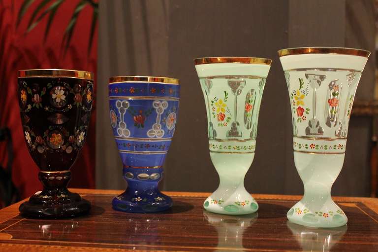 Four fine bohemian early 20th century cut crystal glasses.

Hand-painted with beautifully vivid colors and floral patterns.

Can be sold separately.

Measures:

Light green glasses: Height 19 cm, diameter 10 cm;

Light green glasses:
