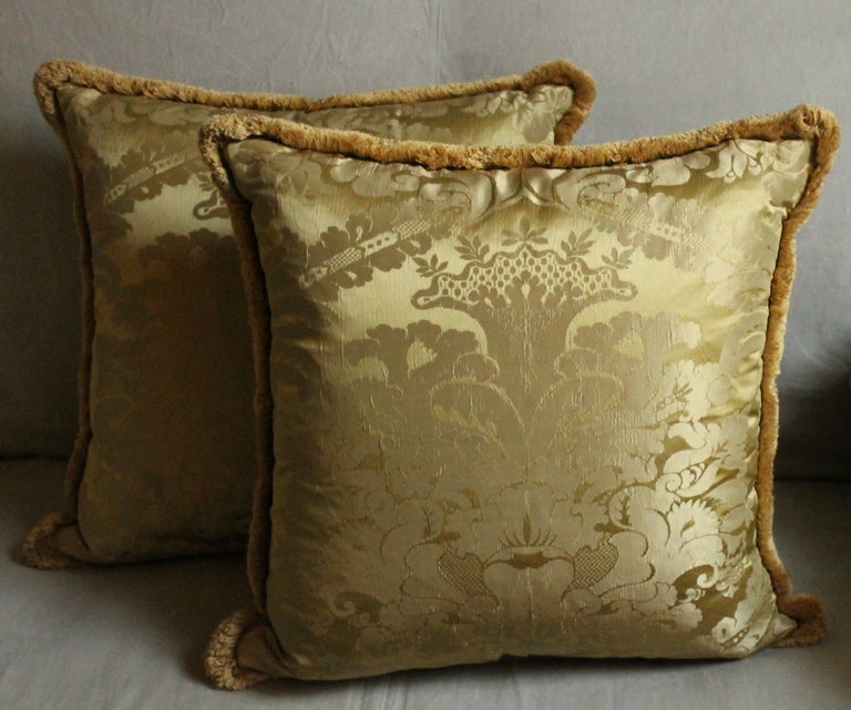 A pair of Italian squared golden damask 100% silk pillows made from vintage Borbonic fabric, the backs are covered with the same silk fabric, gold marabou silk border. 
New fill makes them very sumptuous and comfortable. Excellent clean condition.