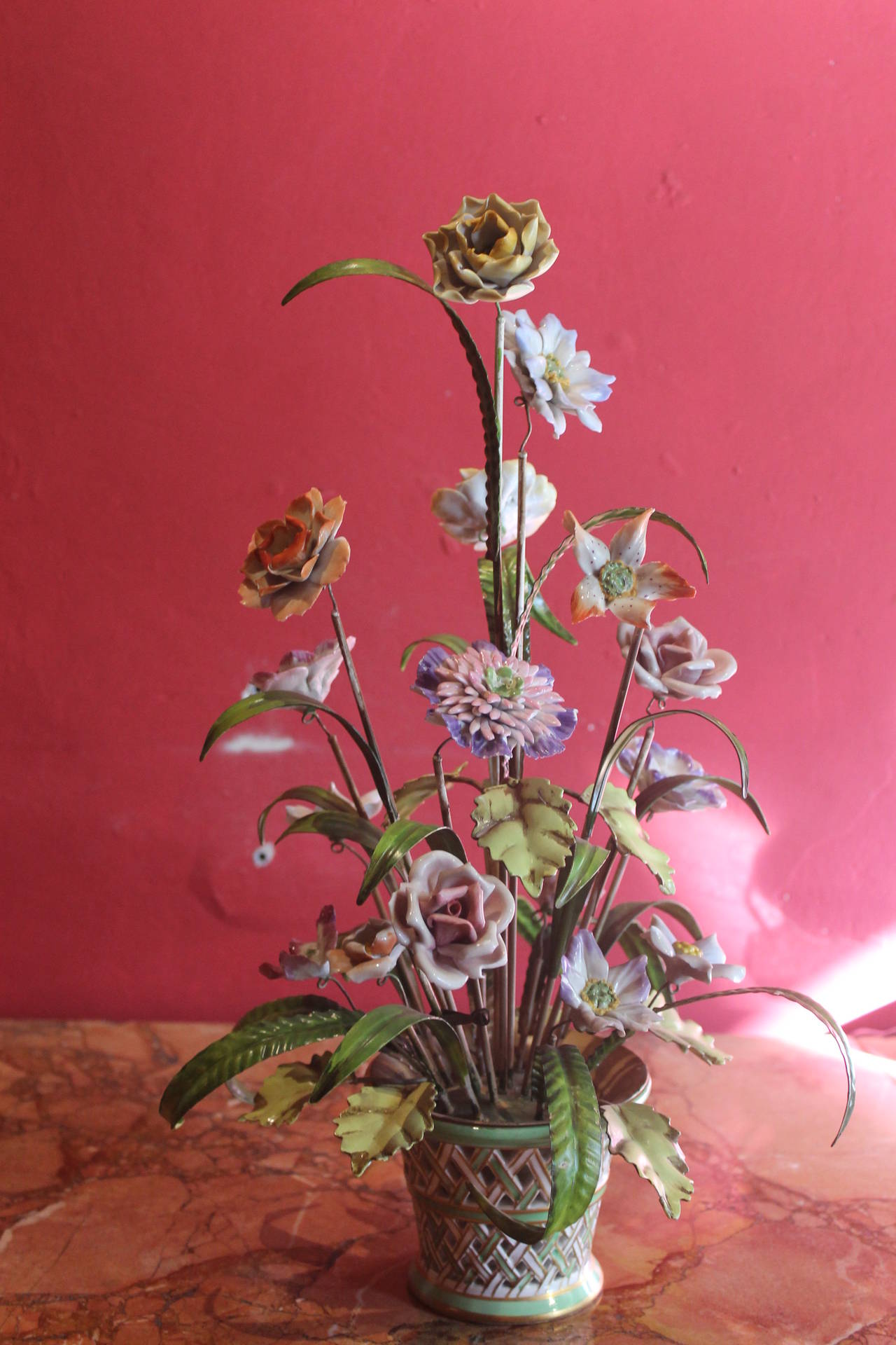 A very fine handmade porcelain flowers tree resting on hand-painted porcelain basket. Tole green leaves, porcelain hand-painted different kind of flowers, extremely detailed,realistic and colorful!A perfect centrepiece.
Measure: Height 42 cm, width