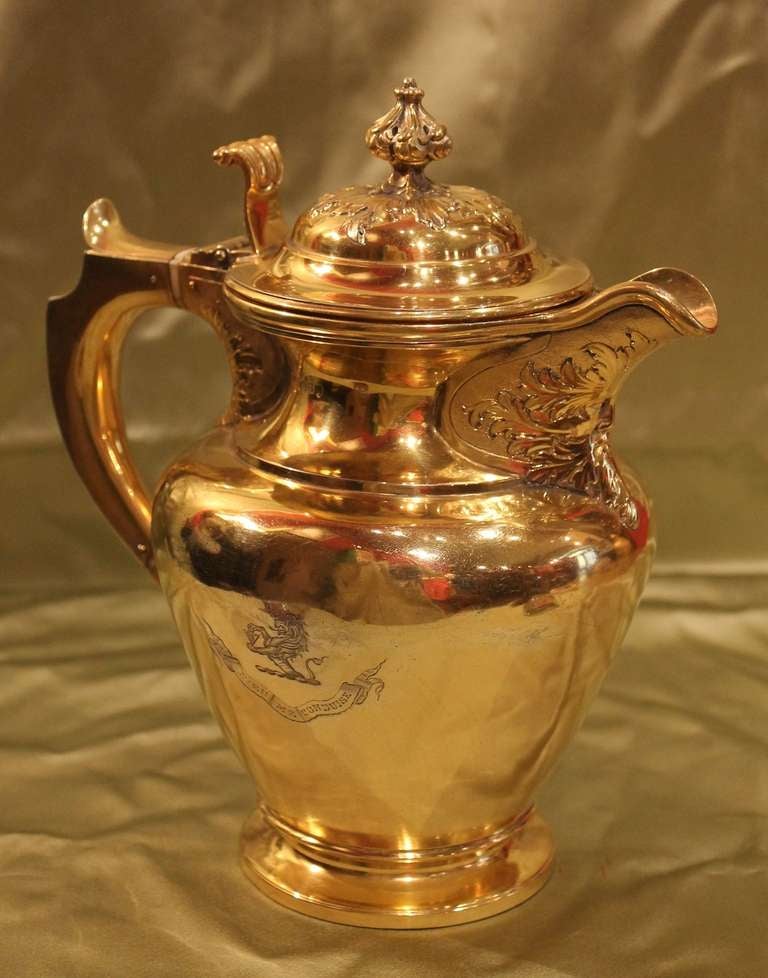 A gilt Silver teapot or coffee pot 1850 circa (Queen Victoria period) made by the silversmith James McKay for the Thorne English family. On a side of the Jug is engraved the motto and the coat of arms of this family. Lovely and shiny