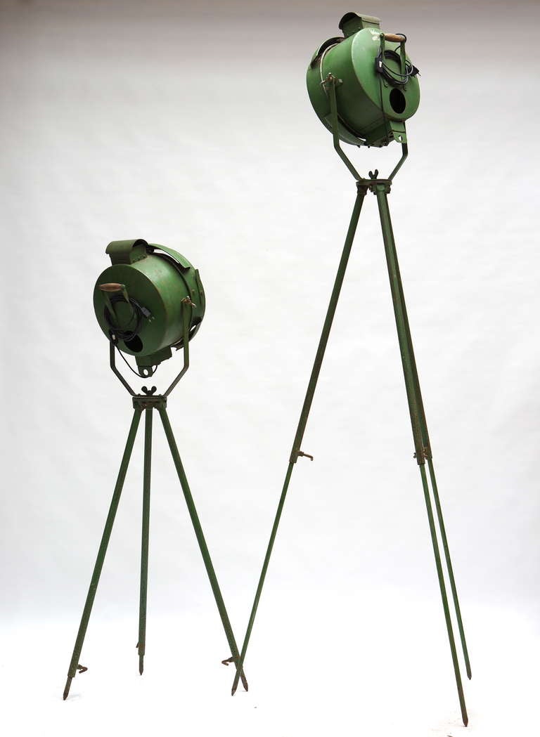 An amazing set of two tripod lights in a fantastic light green finish, completely correct for the period. Wooden handles complete the look. Complete with air vents on the top of the light housing. Newly wired for immediate use!