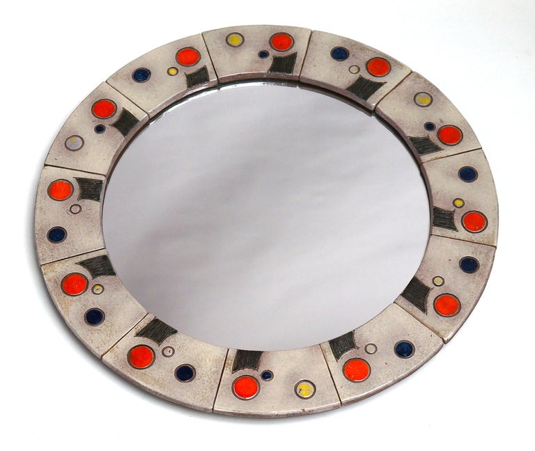 Colorful nice round mirror made by the famous Belgium ceramist, Oswald Tieberghien.