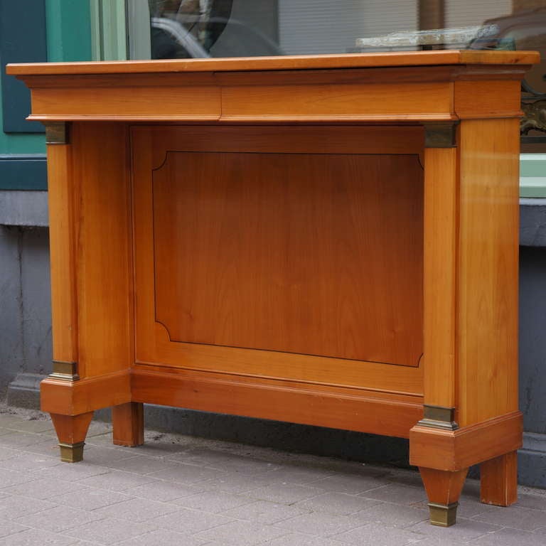 A fine neoclassical cherry wood console,Belgium.
Period: early 1950s. 
In good original condition with bronze details.
Width:120 cm.
Height:96 cm.
Depth:34 cm.