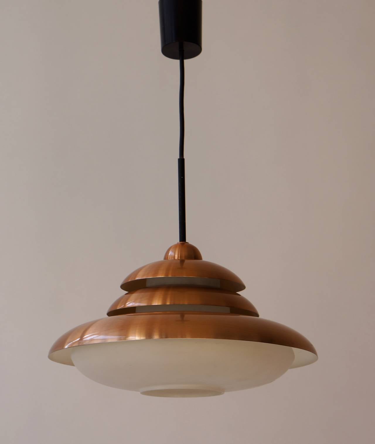 Doria opaline and copper pendant light.