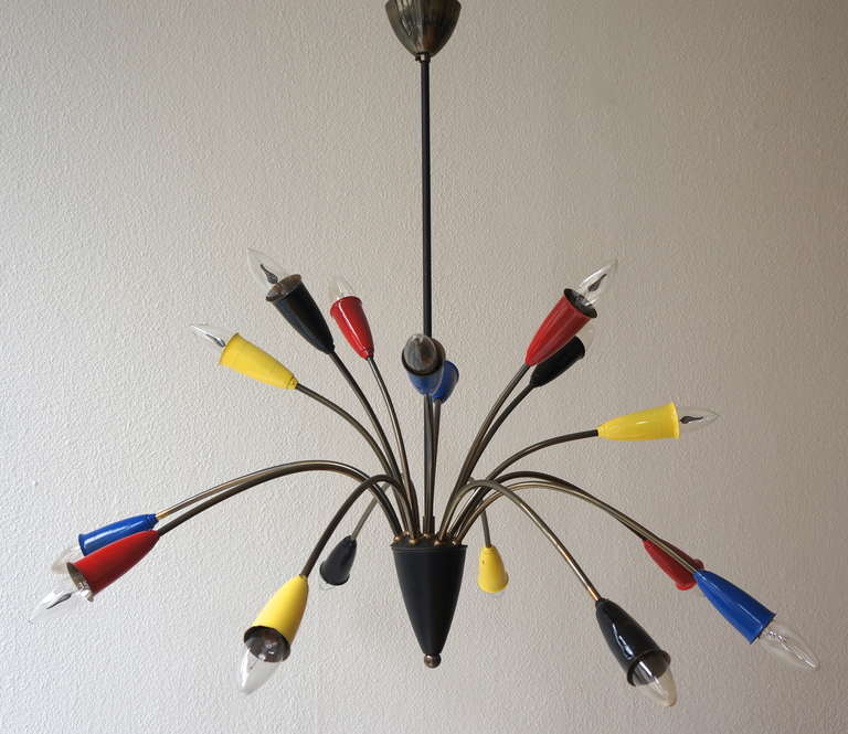 Beautiful chandelier featuring sixteen shiny alternating brass arms and bulbs. The bulb tubes have a different colors.

The heights can be adjusted with a longer stem.