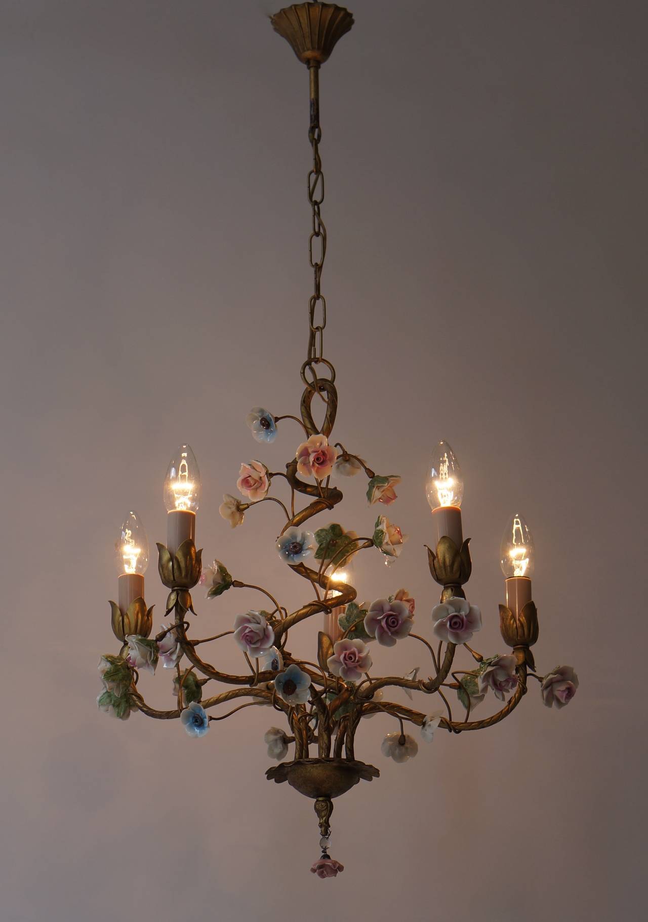 Italian tole chandelier with porcelain flowers. This beautiful five-light handmade chandelier will look great in any room.