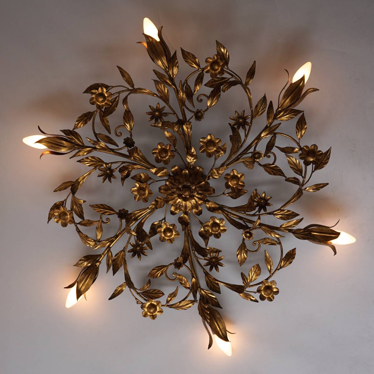 A fabulous organic sculpted metal flush mount covered in gold gilded enamel.
Marked, Ciani Firenze.
Takes eight bulbs. 
Very good condition with no missing branches or leafs.

 87 cm diameter and eight bulbs.