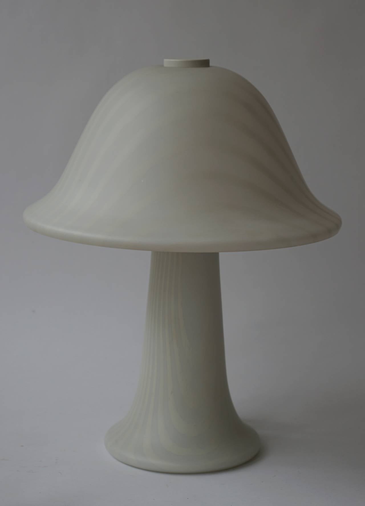 Mushroom style, white frosted glass, with swirl pattern throughout the body and shade. 
Made in Germany.