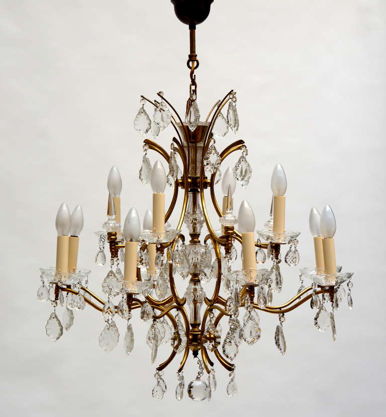 Italian Macaroni eight-arms chandelier with crystals.
Fourteen-lite chandelier.