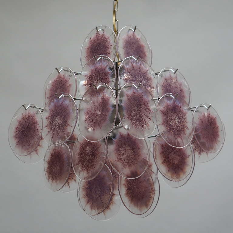 Italian purple Murano glass chandelier with 36 discs.
Measures: Diameter 48 cm.
Height 57 cm.
Total height including the chain 100 cm.